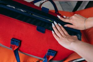 Woman Opening Red Bag